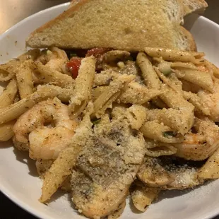 Shrimp Scampi Pasta with Cajun seasoning, mushrooms, and tomatoes