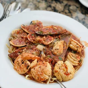 a plate of seafood and pasta