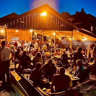 a large group of people sitting outside