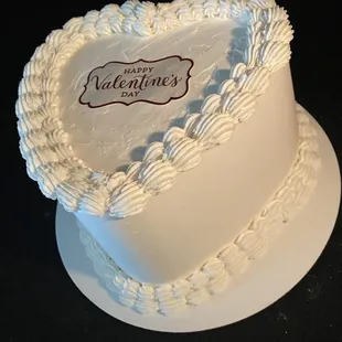 a white heart shaped cake