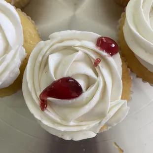 Vanilla cupcake with raspberry  filling.  Vanilla buttercream
