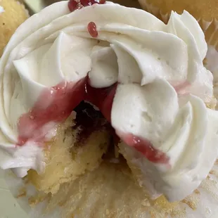 Gluten-free, dairy-free vanilla cupcake, raspberry filling dairy-free vanilla buttercream.
God bless