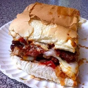 a sandwich on a paper plate