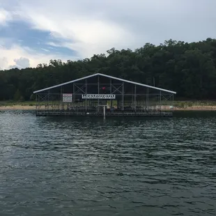a boathouse on a lake