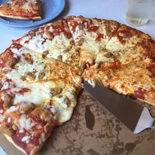 a pizza on a cutting board