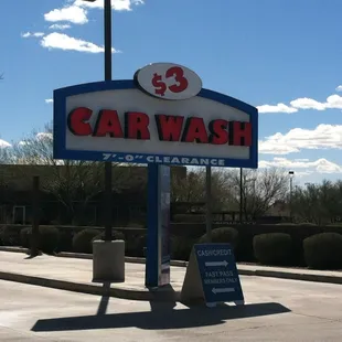 a car wash sign in a parking lot