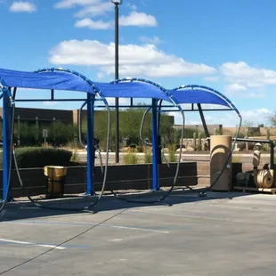 a blue canopy over a parking lot