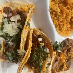 Lunch special carnitas tacos with rice and beans