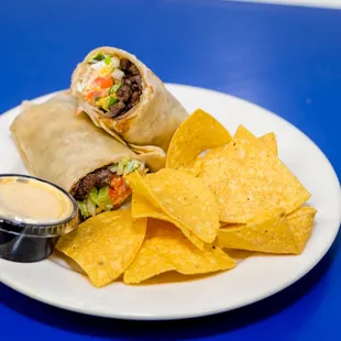 Fresh burrito with chips and queso.