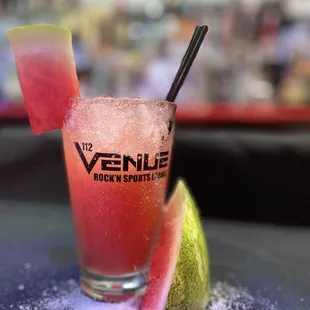 a glass of watermelon and a slice of watermelon