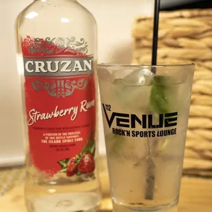 a glass of vodka and a bottle of vodka