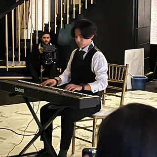 My little brother playing Canon in D for us (bride &amp; groom) at reception/dinner time.