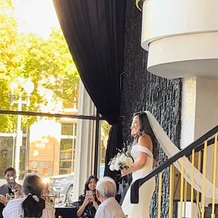 My dad and I walking down the aisle to the alter.