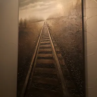 a painting of a train track