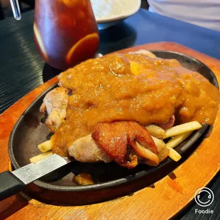 a plate of food with fries and sauce