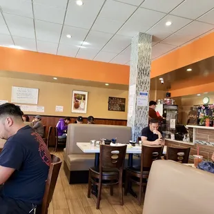 diners sitting at tables in a restaurant