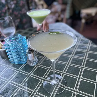 a martini with a lime garnish