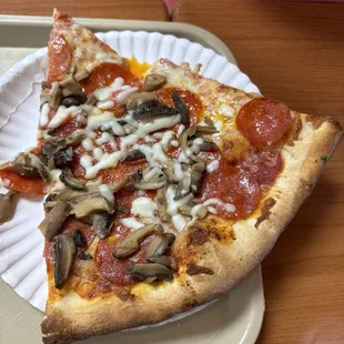 Pizza slice ($2.50) plus two toppings at $0.75 each