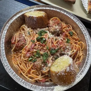 Spaghetti with marinara sauce and meatballs.