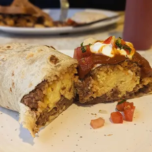 Huge Breakfast Burrito special. Egg, cheese, beans, rice, and sausage. $10.95