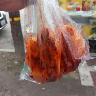 Mango on a stick the mangos they use are some of the best they go out of their way to pick the best fruit