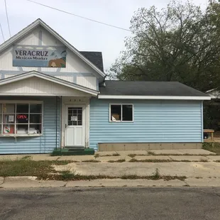 a blue building with white trim