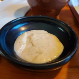 a bowl of dip and chips