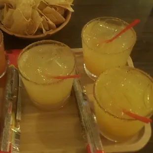 Margarita flight strawberry raspberry banana in the middle Peach and mango