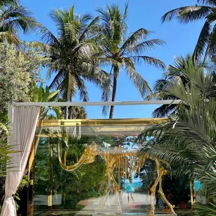 the entrance to a tropical garden