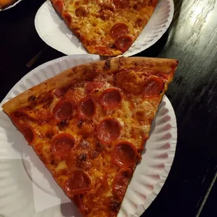 Burnt pizza slices that look better in this photo than it is.