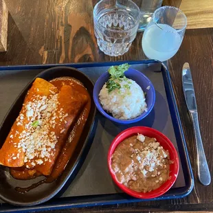 Chicken Enchiladas, Cilantro Rice and Refried Beans.