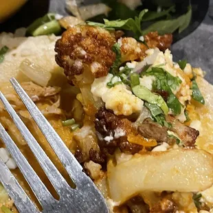 Overcooked cauliflower taco drenched in oil