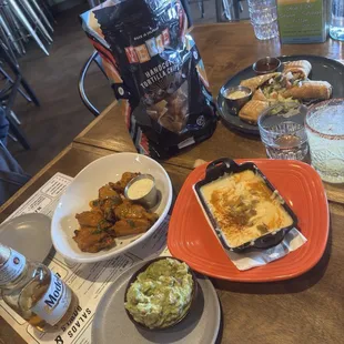 Guacamole, chili con queso, mini chimichangas wings, a great spicy margarita and a large bag of delightful chips.