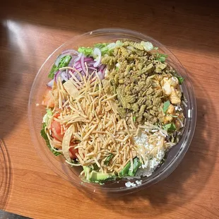 a salad in a plastic bowl