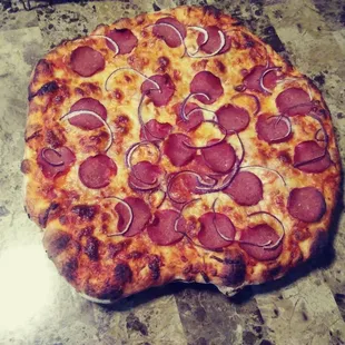 Pepperoni and onion made with house dough ball on pellet grill