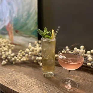 two cocktails on a wooden table