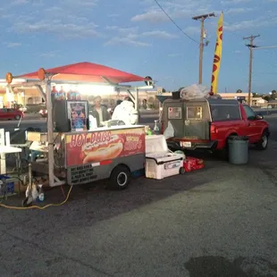 a verizon hot dog cart in a parking lot