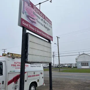 a truck parked in front of a restaurant