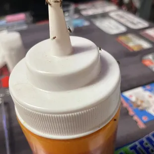 a ketchup in a plastic cup