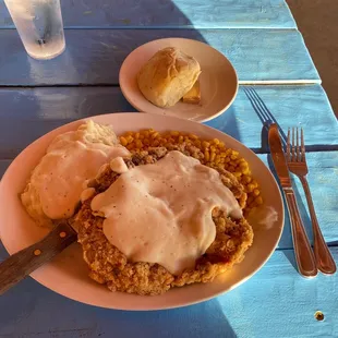 Chicken fried steak mashed potatoes corn and Aron