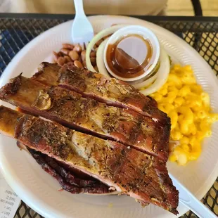 Ribs,  brisket,  sausage,  Mac and cheese, and beans.