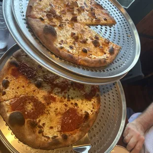 Buffalo chicken pizza (top) and quattro formaggi