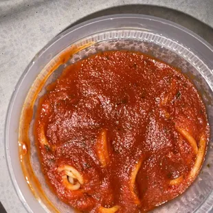 Side of pasta with marinara sauce.
