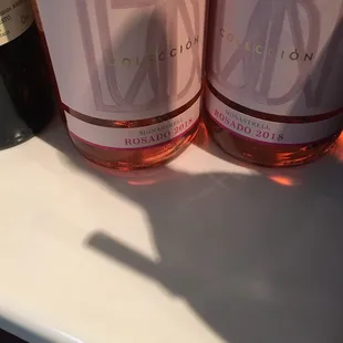 two bottles of wine on a counter