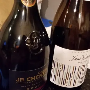 two bottles of wine on a counter