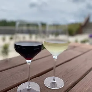 two glasses of wine on a table