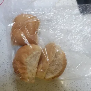 two buns wrapped in plastic