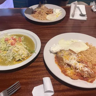 Beef enchilada with green sauce, chilaquiles in red sauce. Eggs over easy with rice