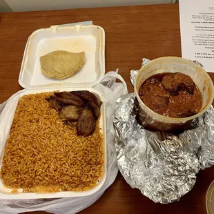 Red stew fish with jollof rice. Think it was like $24?  Good value snd big portion. Taste great too!   Neat pie was also excellent.