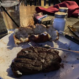 a steak on a plate with a fork